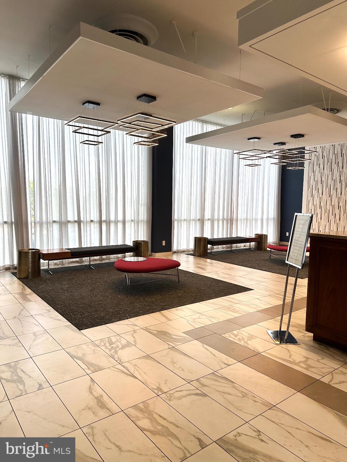 4600 Duke Street, Unit 701 Alexandria, VA 22304 - Photo 30 of 36 Modern elegance in a bright lobby.