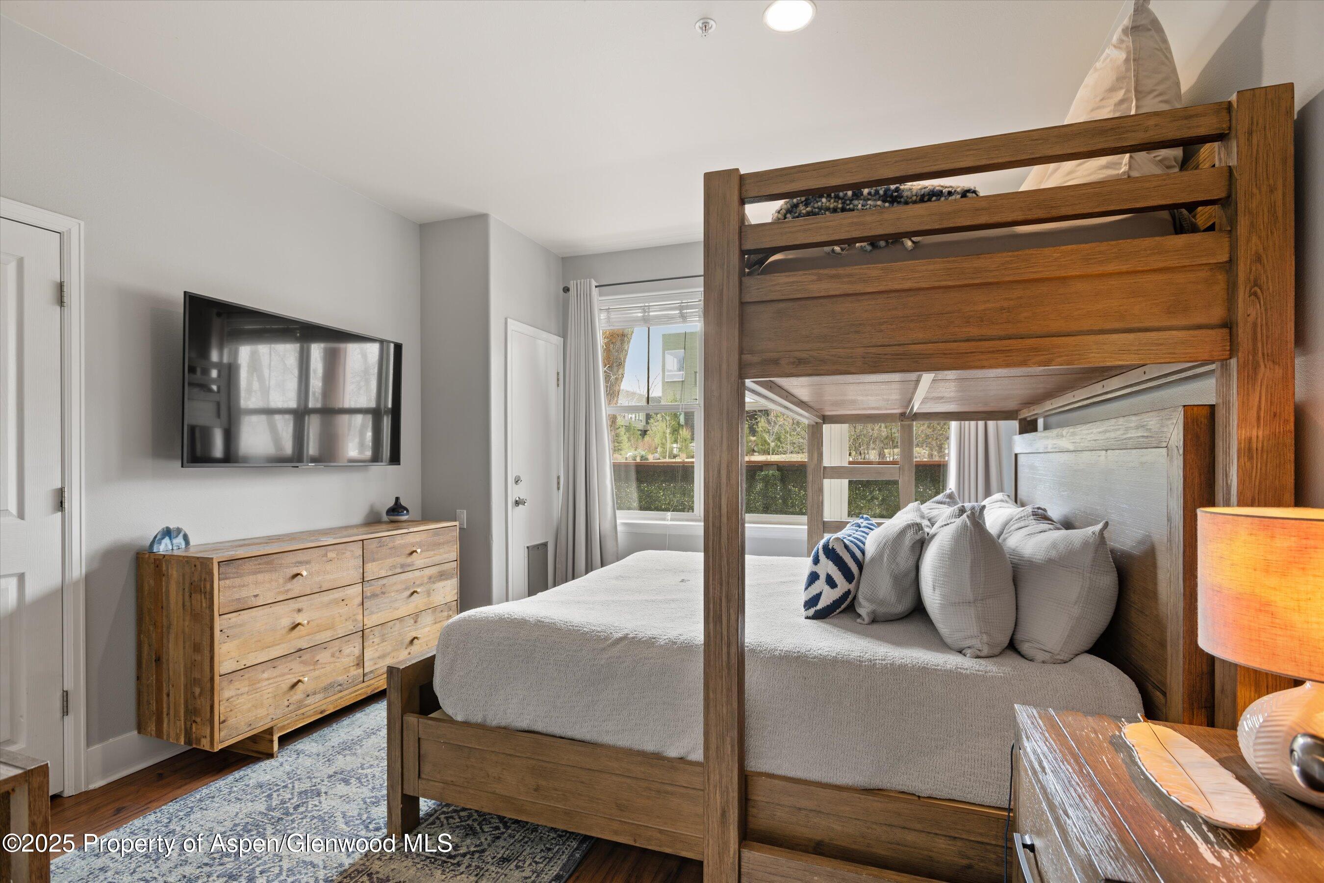 712 Evans Court Basalt, CO 81621 - Photo 11 of 23 a bedroom with a bed and large windows