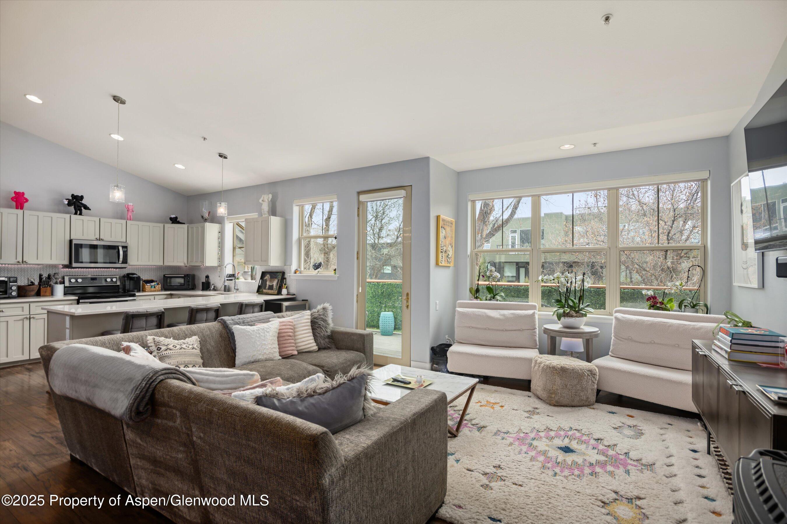 712 Evans Court Basalt, CO 81621 - Photo 2 of 23 a living room with furniture and a large window