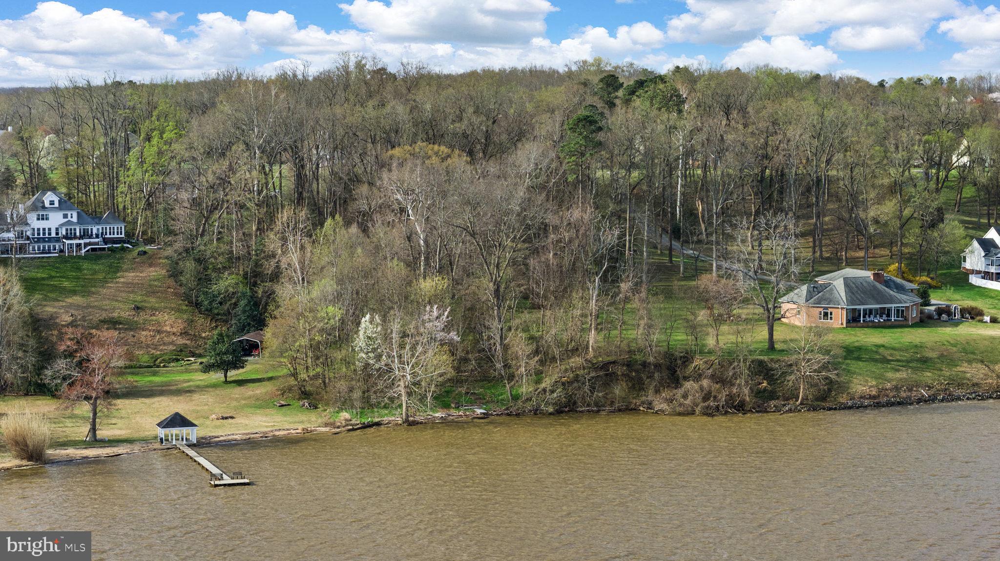 Portobago Trail Port Port Royal, VA 22535 - Photo 19 of 25 an aerial view of a house with a yard and lake view