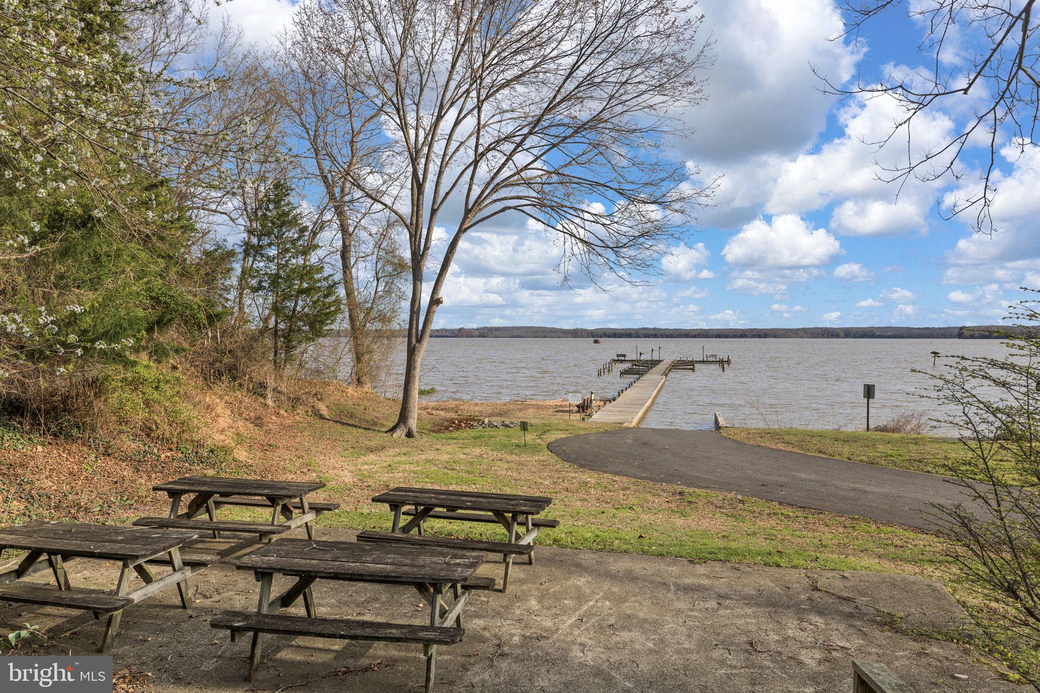 Portobago Trail Port Port Royal, VA 22535 - Photo 5 of 25 a view of a backyard with lawn chairs under an umbrella