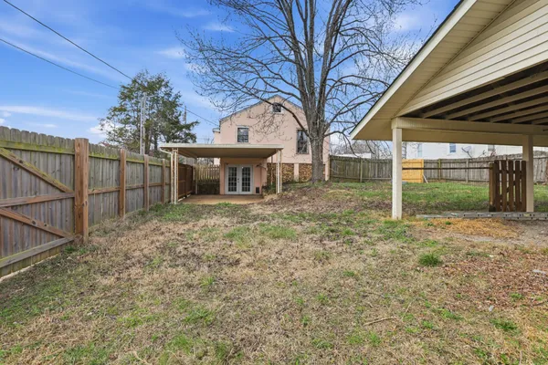 a backyard of a house with lots of green space