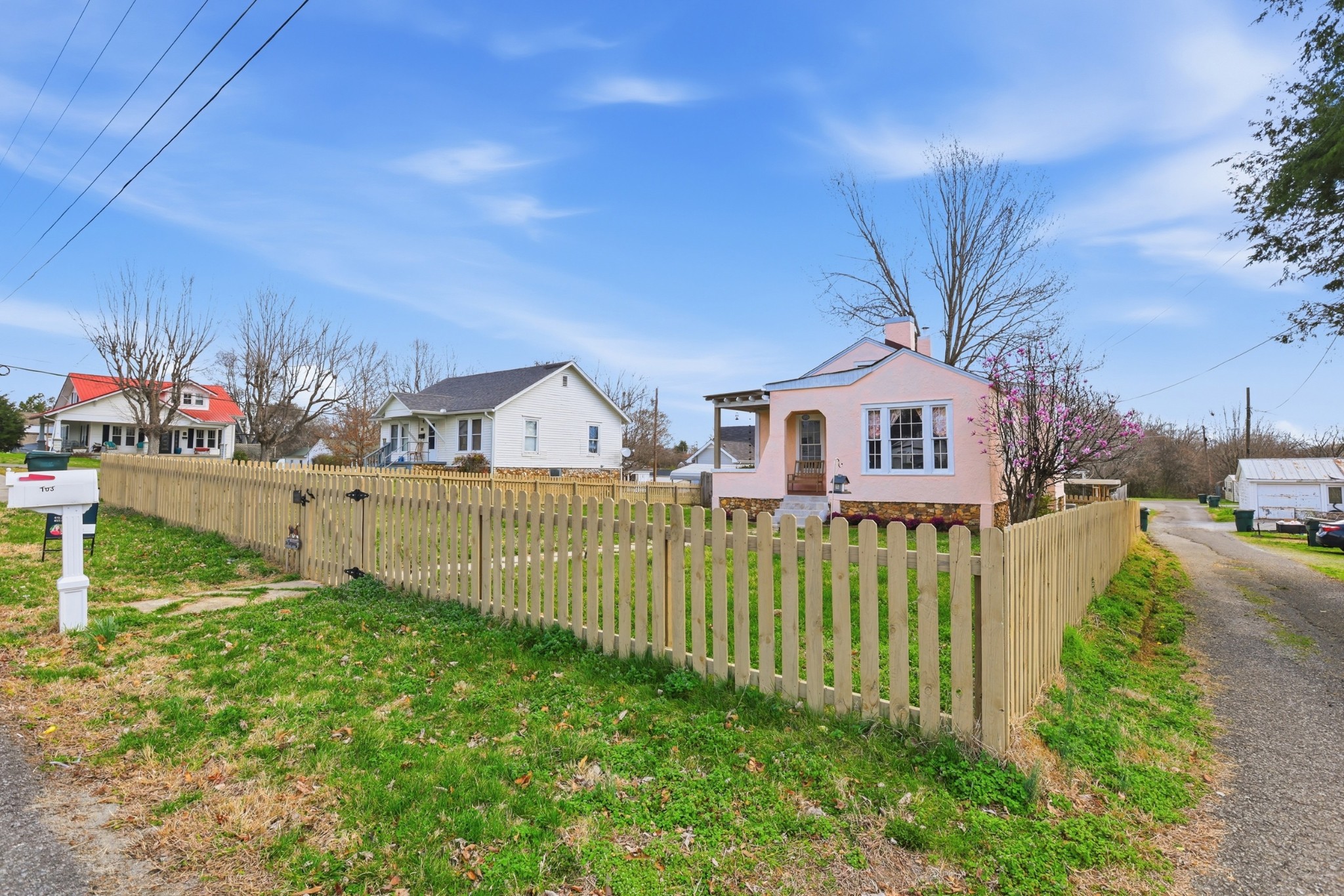 103 Freeman Avenue Dickson, TN 37055 - Photo 16 of 16 a view of a house with a small yard and wooden fence