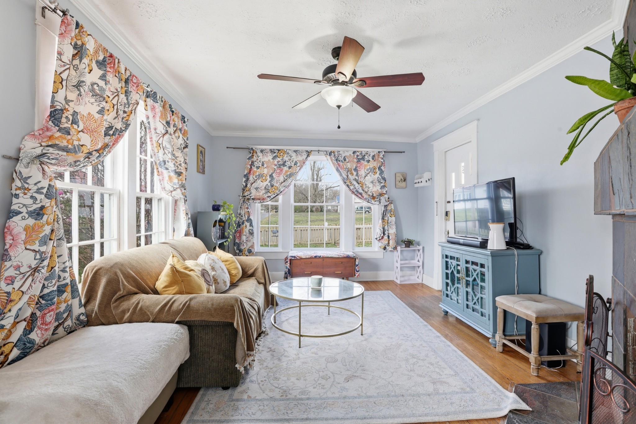 103 Freeman Avenue Dickson, TN 37055 - Photo 4 of 16 a living room with furniture a flat screen tv and a large window