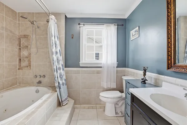 a bathroom with a sink a toilet and a bathtub