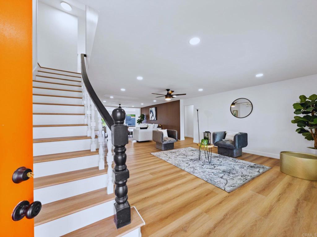 a view of a living room and entryway