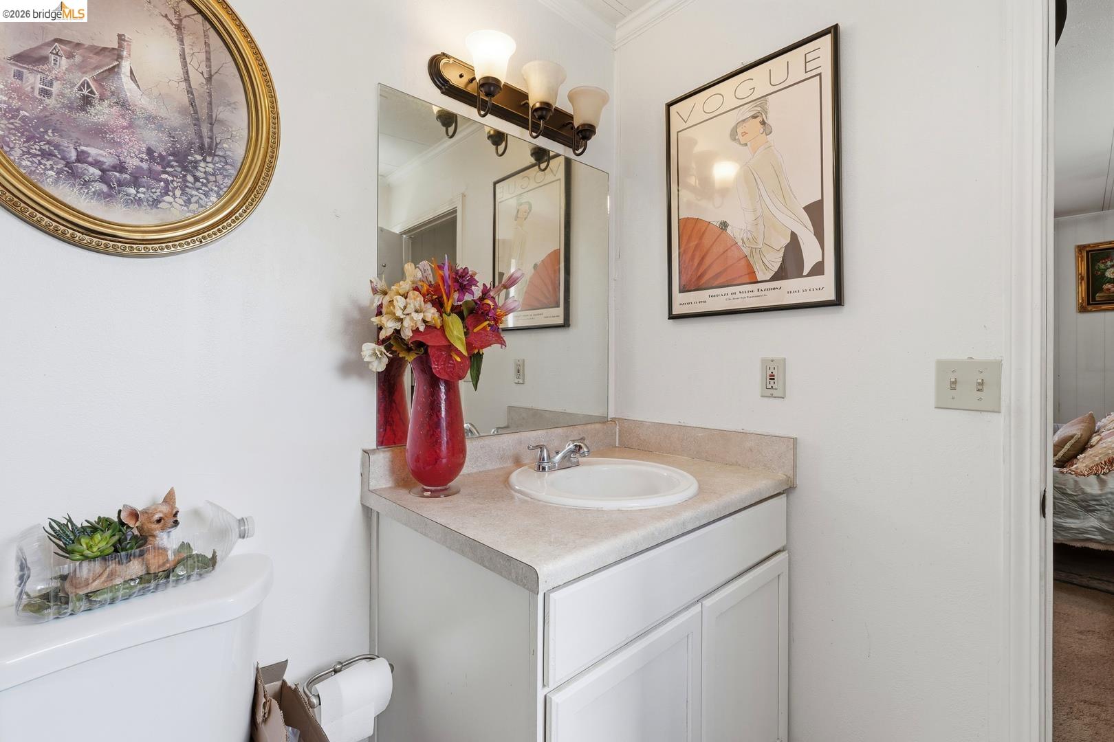8200 Jantzen Road Modesto, CA 95357 - Photo 3 of 6 a bathroom with a sink mirror and vanity