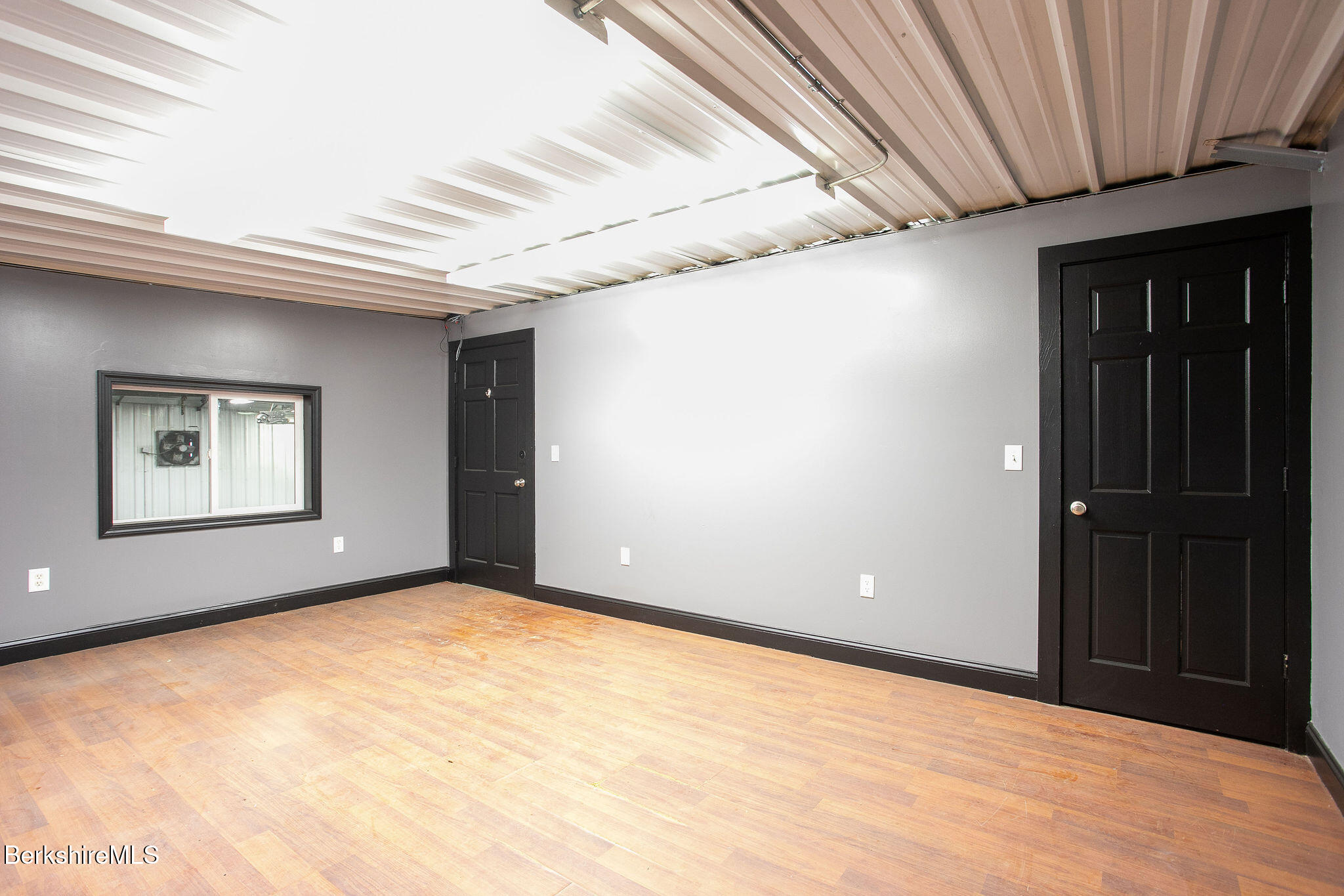 11 Roger Road Great Barrington, MA 01230 - Photo 14 of 20 a view of an empty room with windows