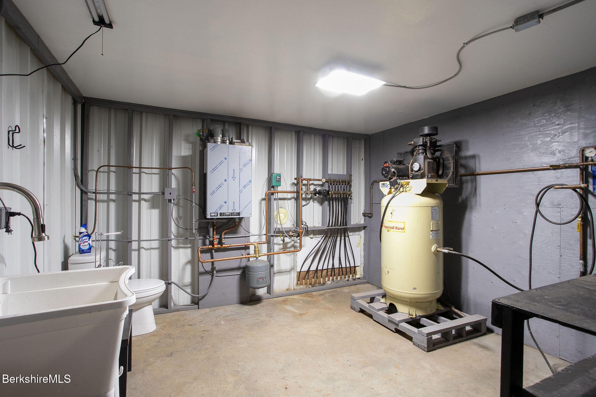 11 Roger Road Great Barrington, MA 01230 - Photo 18 of 20 a view of a kitchen with refrigerator and workspace