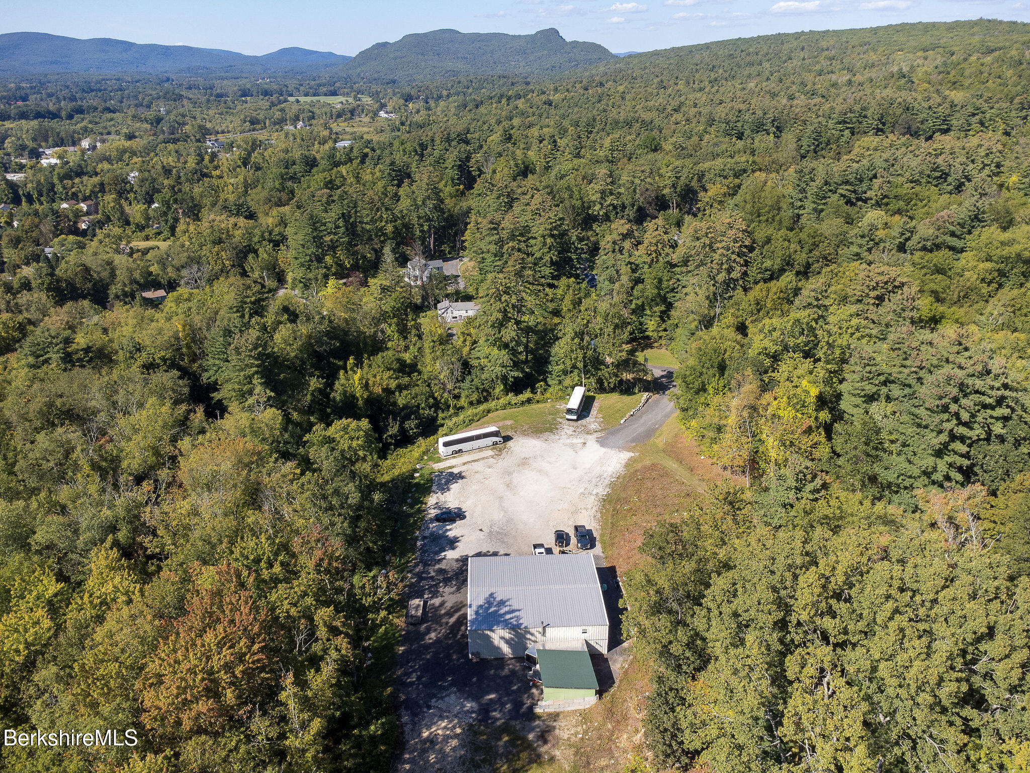11 Roger Road Great Barrington, MA 01230 - Photo 8 of 20 a view of a lush green field with mountains in the background