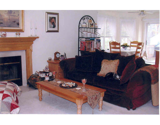 7 Hall Road Webster, MA 01570 - Photo 3 of 10 a living room with furniture a fireplace and a window