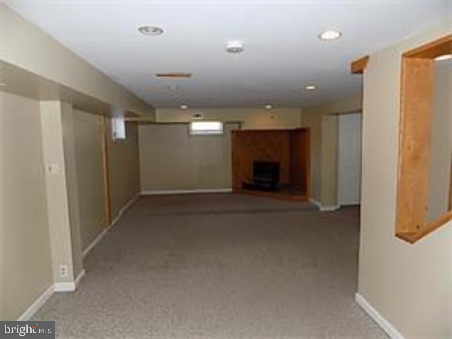 501 Exeter Road Reading, PA 19606 - Photo 8 of 14 a view of an empty room with a fireplace