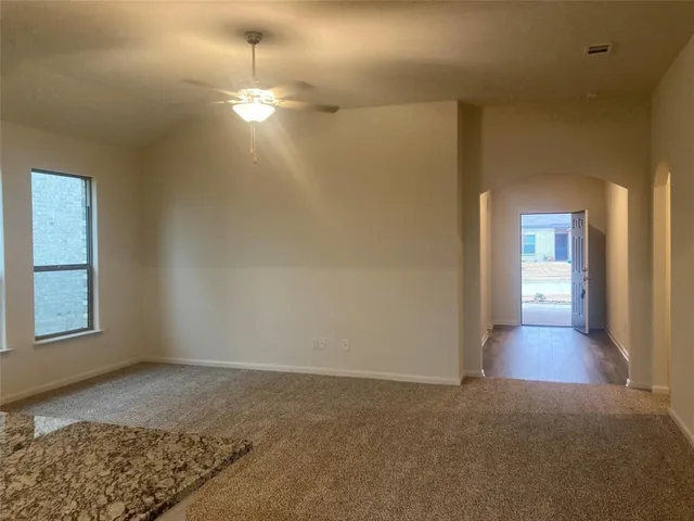 a view of a kitchen from the hallway