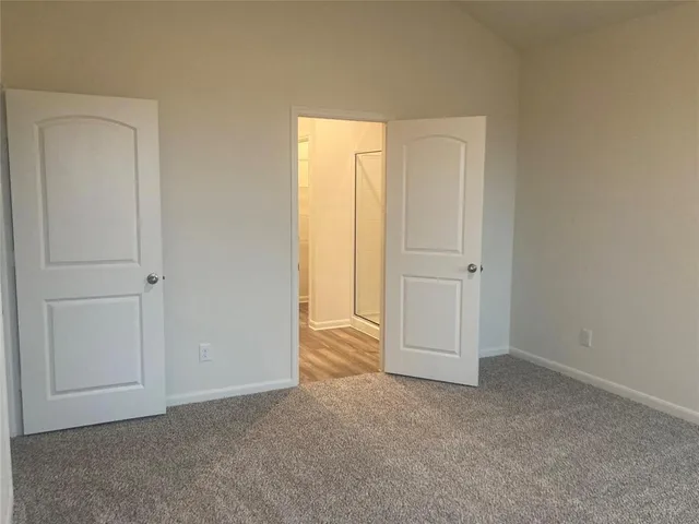 a bathroom with a shower and a sink
