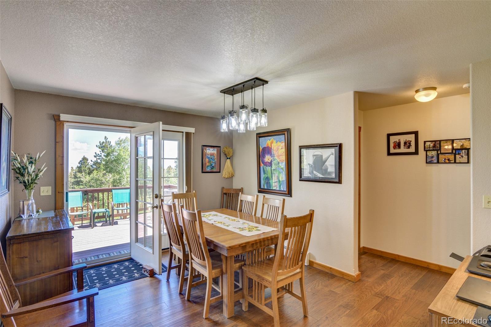 3135 Singletree Road Hartsel, CO 80449 - Photo 13 of 40 a view of a dining room with furniture window and wooden floor