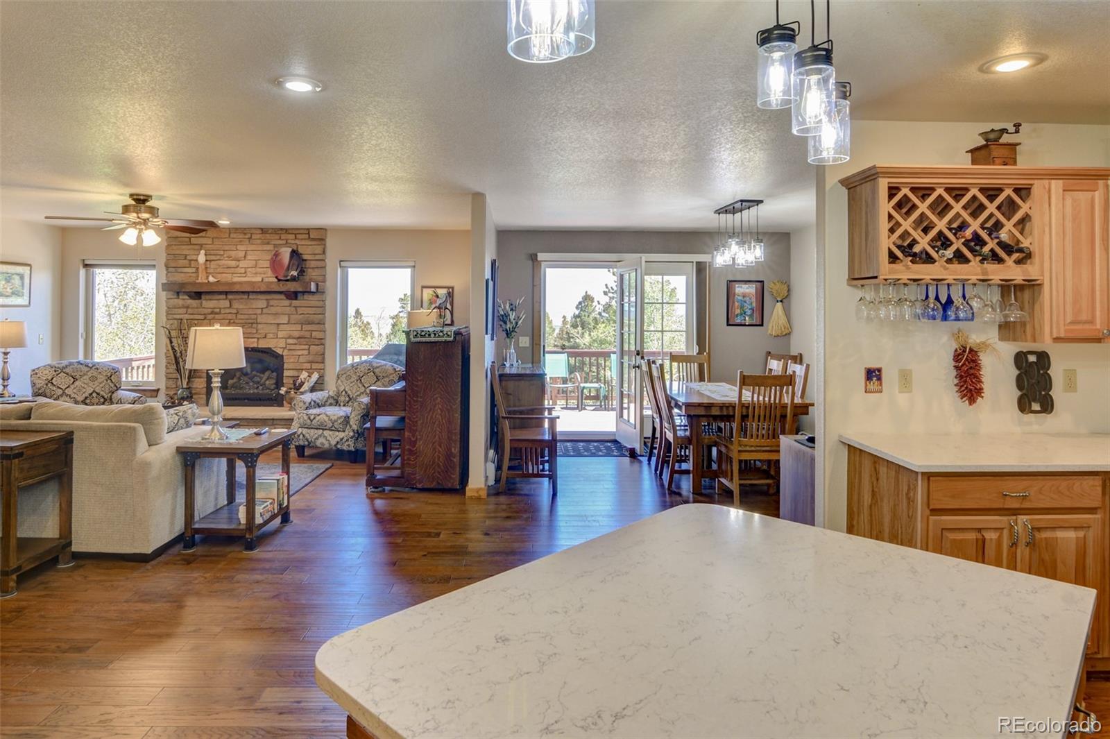 3135 Singletree Road Hartsel, CO 80449 - Photo 15 of 40 a kitchen with sink and refrigerator