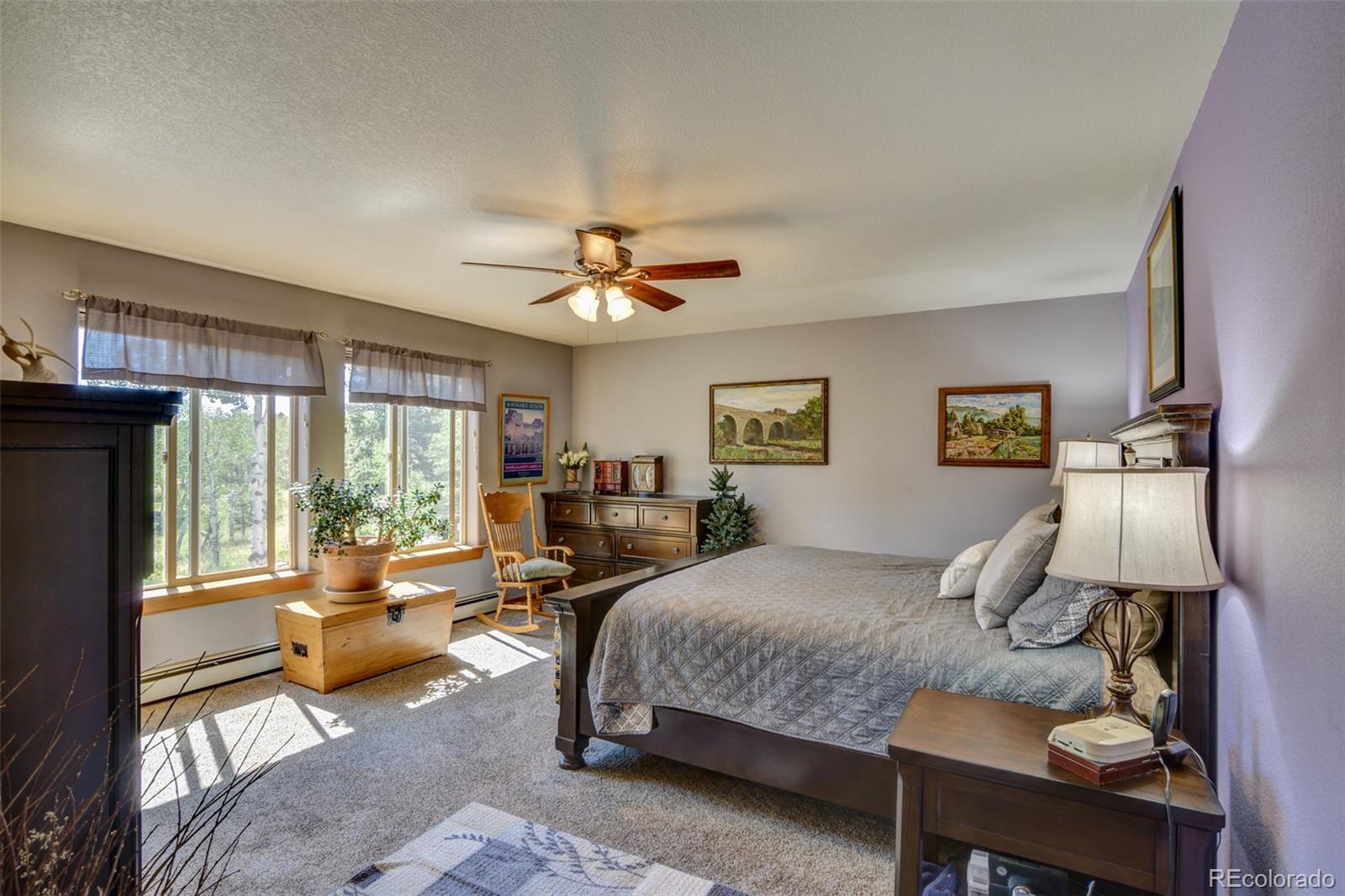 3135 Singletree Road Hartsel, CO 80449 - Photo 19 of 40 a bedroom with a bed a couch and dresser