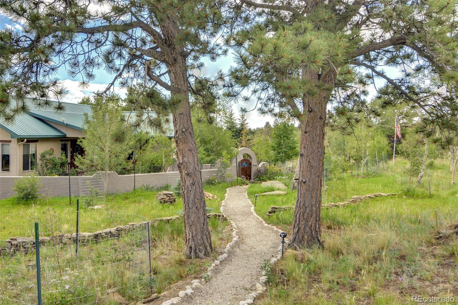 3135 Singletree Road Hartsel, CO 80449 - Photo 37 of 40 a view of a swimming pool with a patio