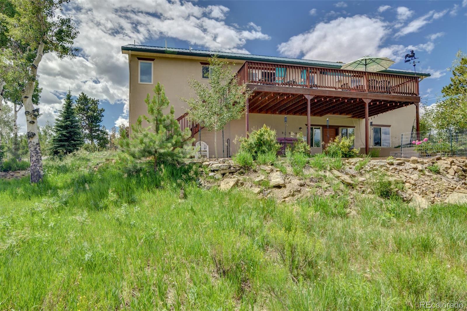 3135 Singletree Road Hartsel, CO 80449 - Photo 5 of 40 front view of a house with a big yard