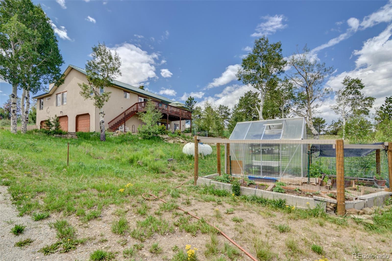 3135 Singletree Road Hartsel, CO 80449 - Photo 8 of 40 a view of a house with a yard and sitting area