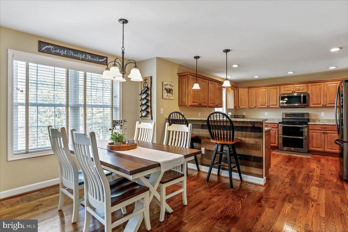 175 Lower View Road Strasburg, VA 22657 - Photo 23 of 100 a view of a dining room with furniture window and wooden floor