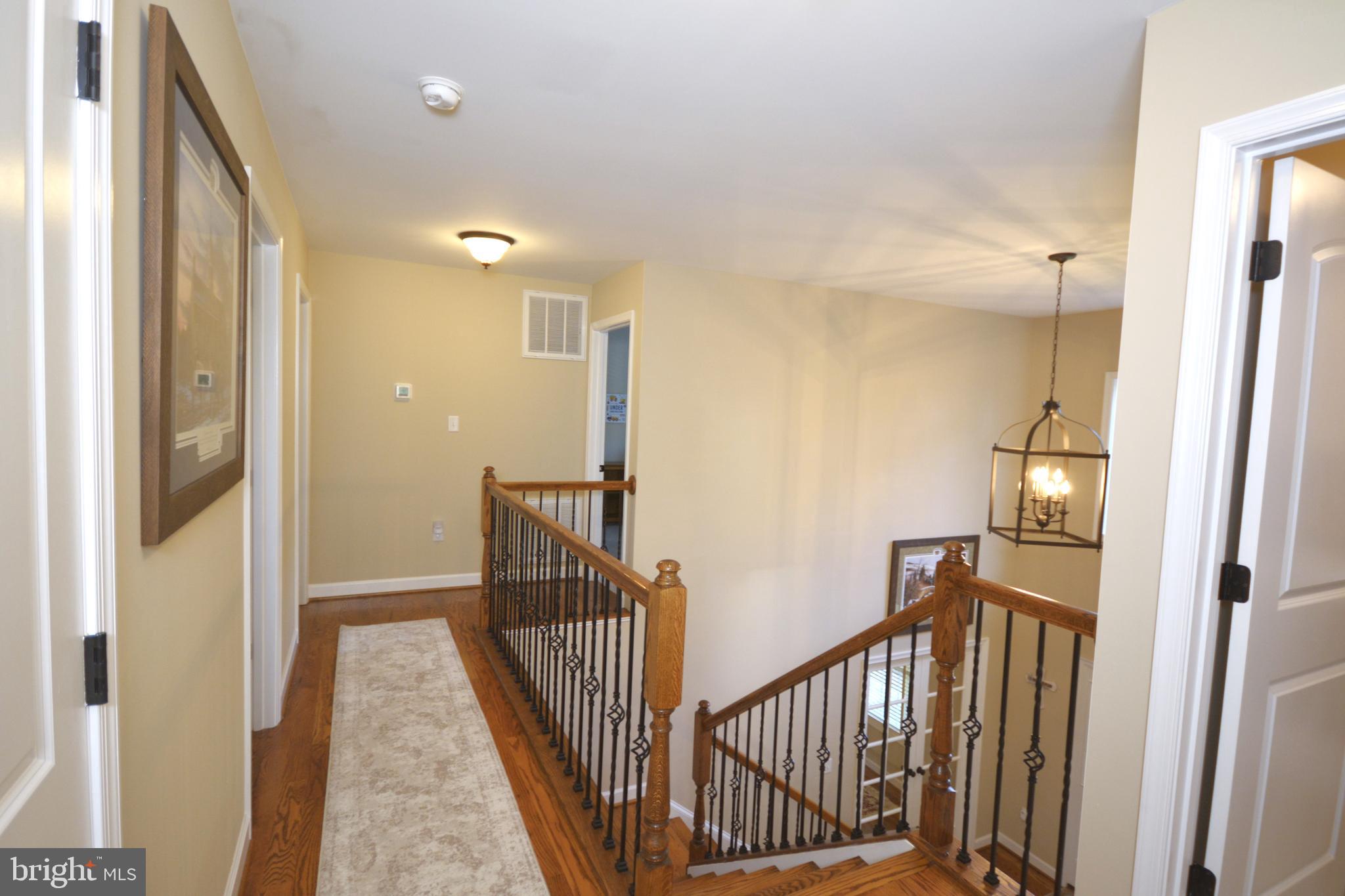 175 Lower View Road Strasburg, VA 22657 - Photo 44 of 100 a view of a hallway with wooden floor and staircase