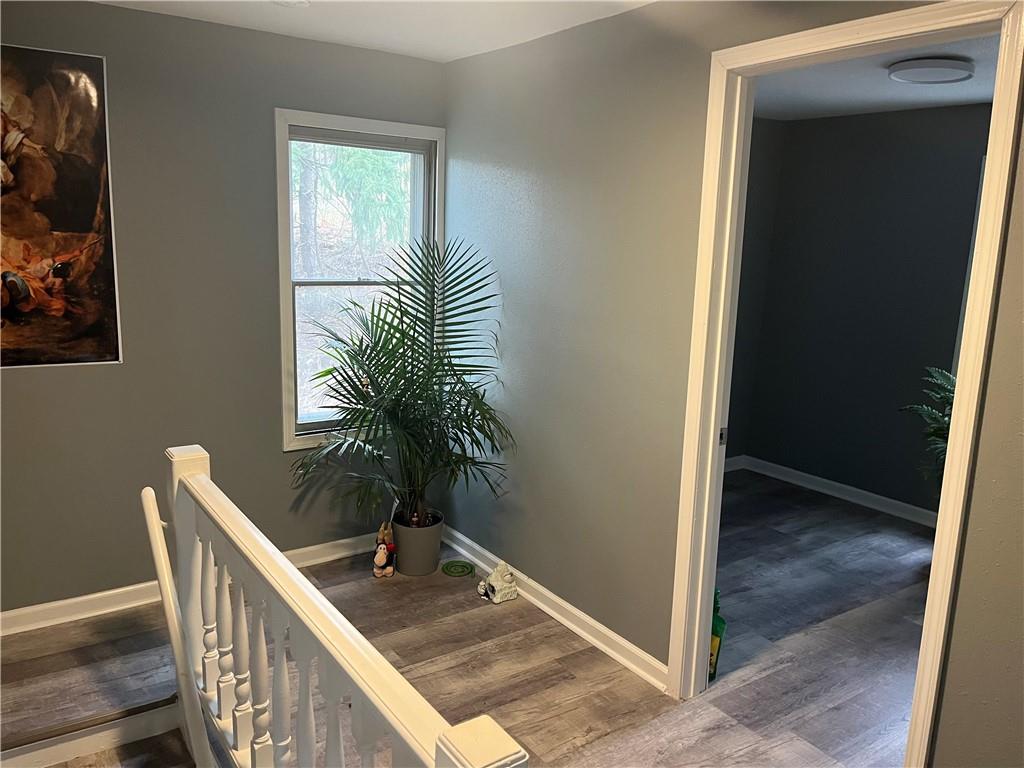 882 Center Road Pittsburgh, PA 15239 - Photo 7 of 13 a view of a hallway with potted plants