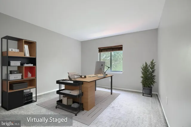 a view of a workspace with furniture