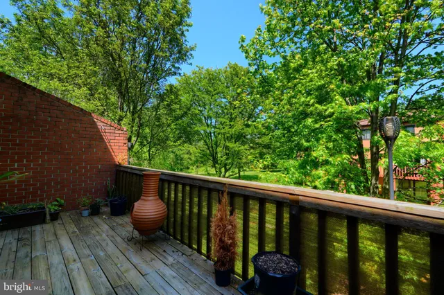 a view of balcony with wooden floor