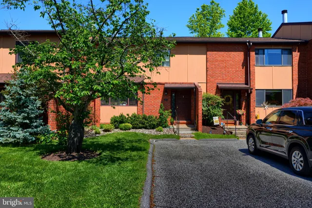 a view of a car park in front of house