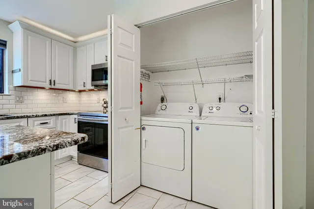 a kitchen with cabinets and appliances