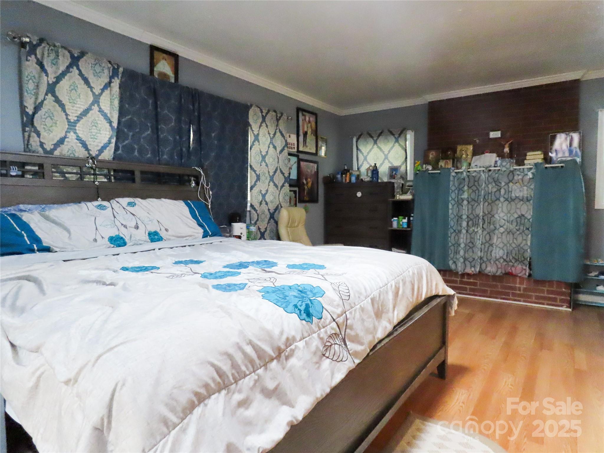 214 West Springs Street Lancaster, SC 29720 - Photo 15 of 33 a bed sitting in a bedroom and a night stand