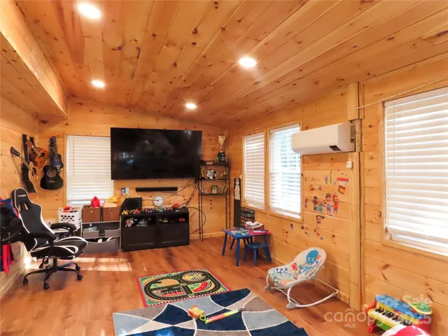 a bed room with a bed and a window