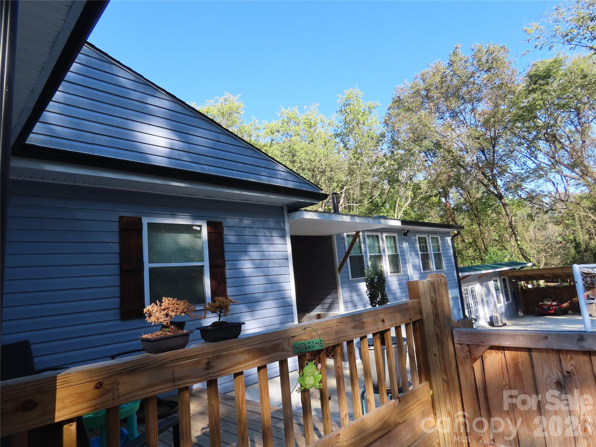 214 West Springs Street Lancaster, SC 29720 - Photo 2 of 33 a front view of house with deck and furniture