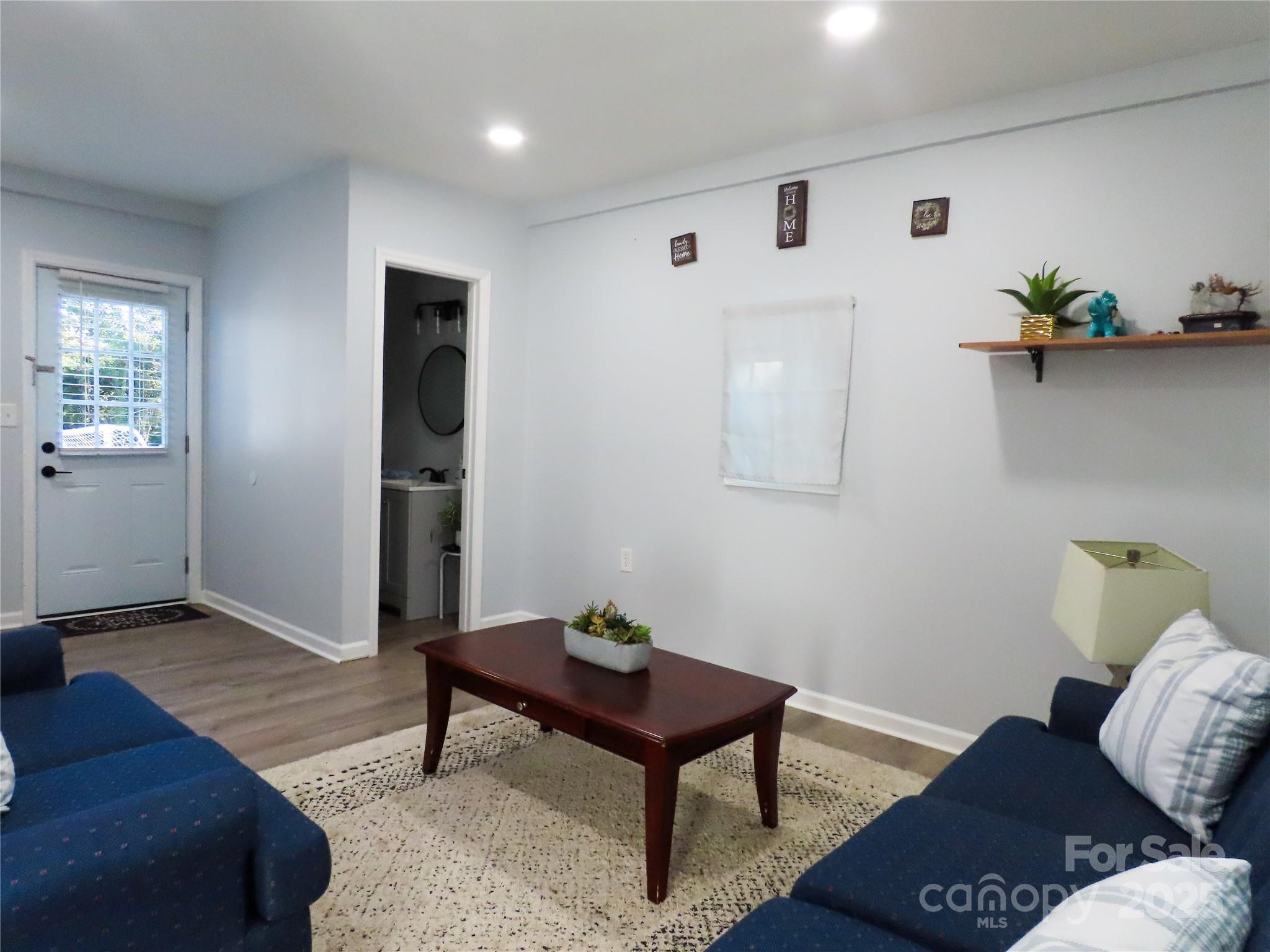 214 West Springs Street Lancaster, SC 29720 - Photo 25 of 33 a living room with furniture and wooden floor