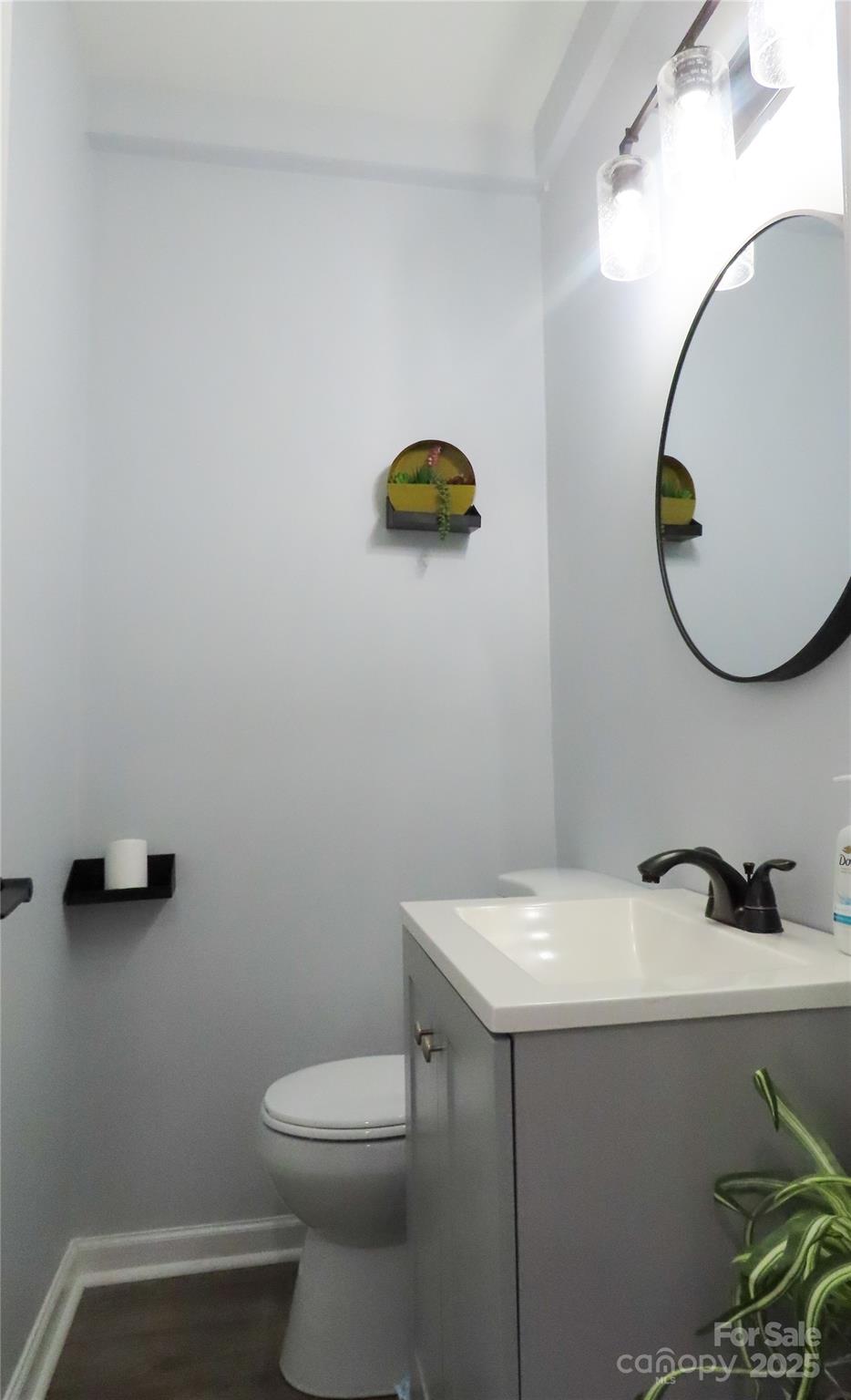 214 West Springs Street Lancaster, SC 29720 - Photo 27 of 33 a bathroom with a sink mirror and toilet