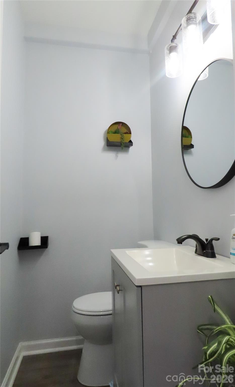 214 West Springs Street Lancaster, SC 29720 - Photo 27 of 33 a bathroom with a sink mirror and toilet