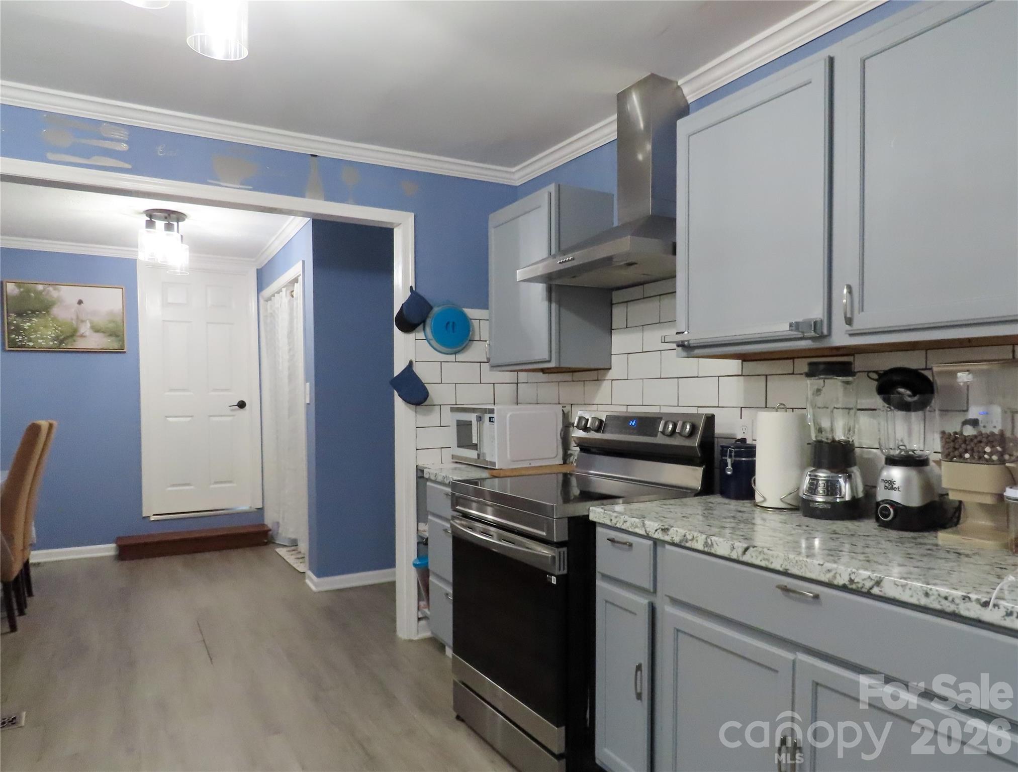 214 West Springs Street Lancaster, SC 29720 - Photo 33 of 33 a kitchen with stainless steel appliances granite countertop a stove a sink and a refrigerator