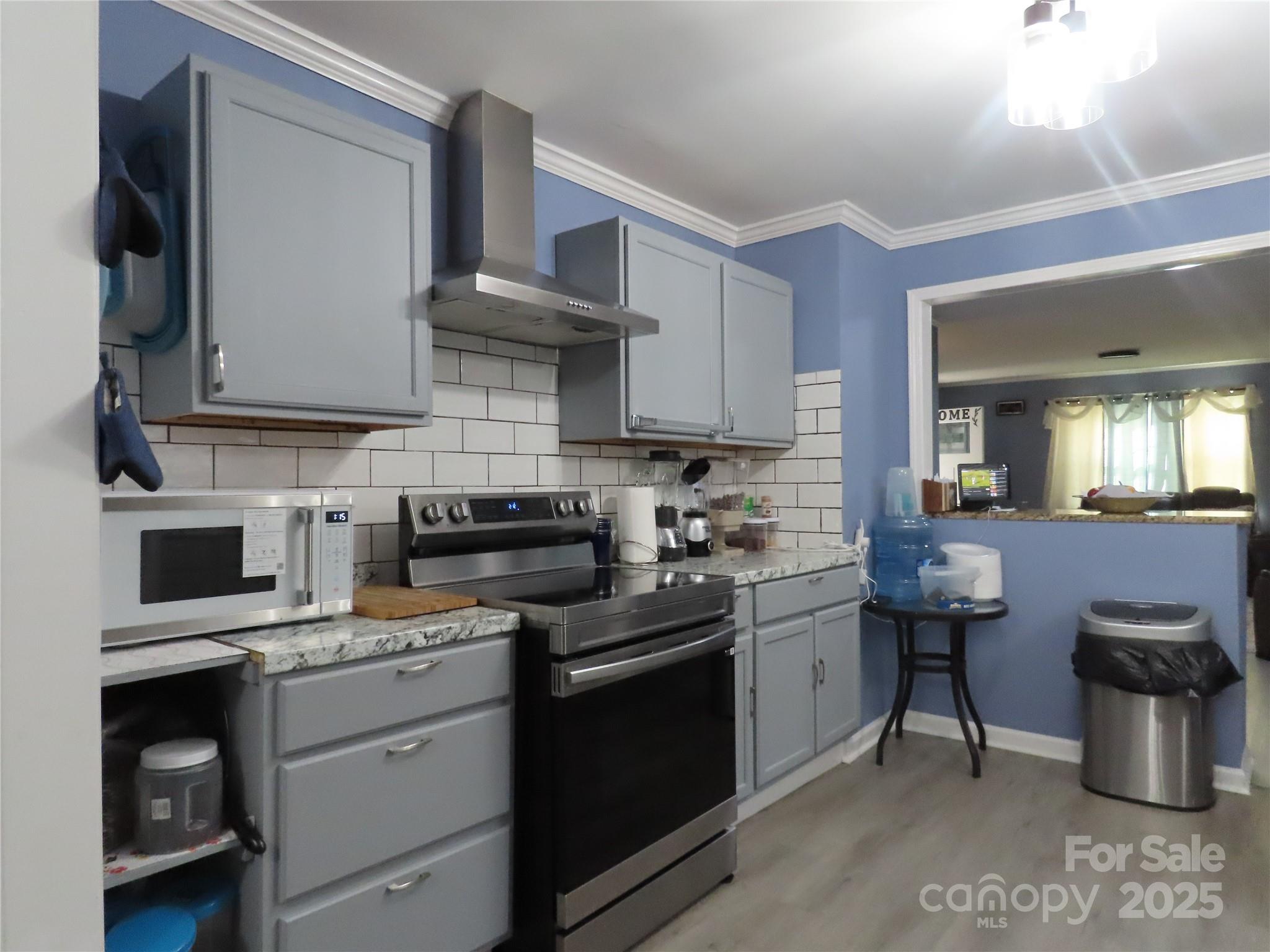 214 West Springs Street Lancaster, SC 29720 - Photo 6 of 33 a kitchen with a sink cabinets and stainless steel appliances