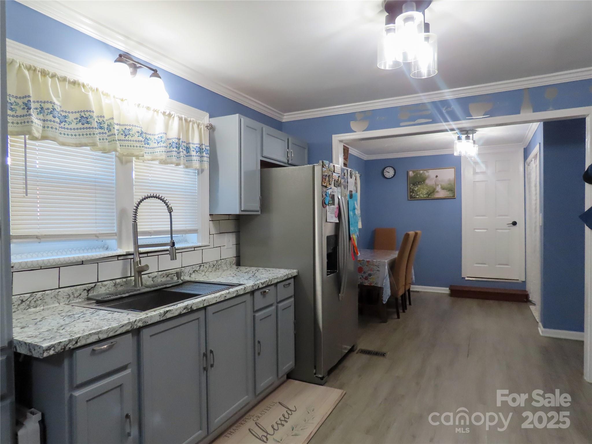 214 West Springs Street Lancaster, SC 29720 - Photo 8 of 33 a kitchen with a sink and refrigerator