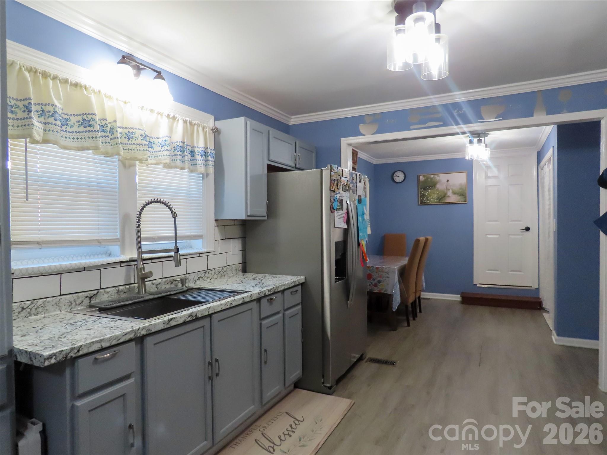214 West Springs Street Lancaster, SC 29720 - Photo 9 of 33 a kitchen with a sink and refrigerator