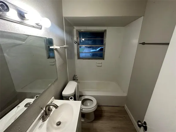 a bathroom with a sink and a shower