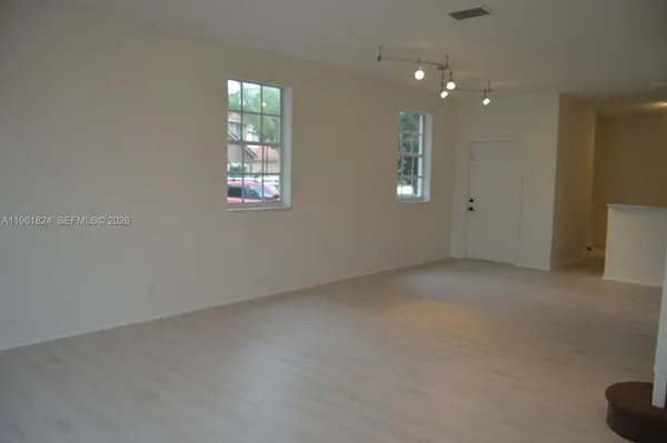 an empty room with windows