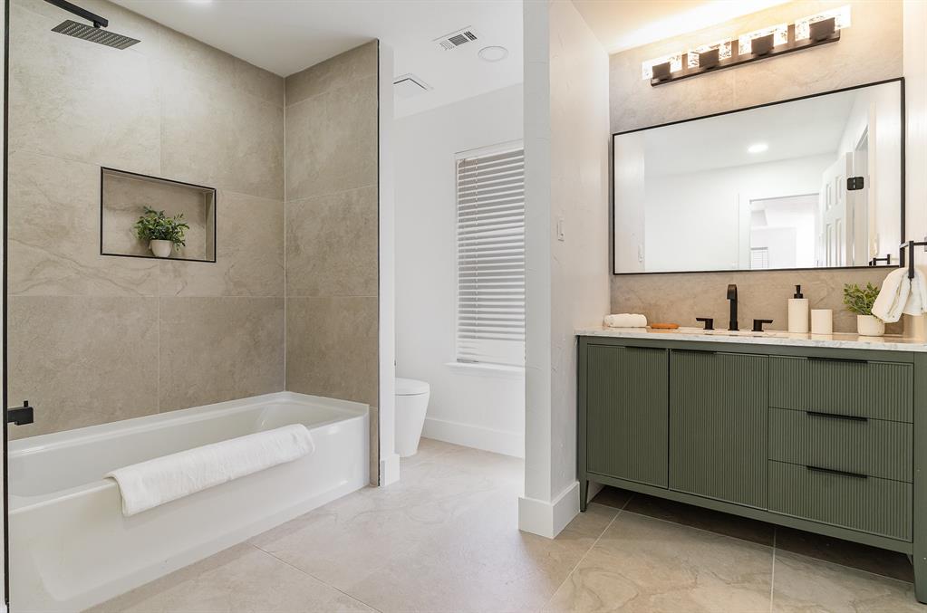 7524 Aberdon Road Dallas, TX 75252 - Photo 26 of 39 Bathroom featuring toilet, vanity, visible vents, and baseboards