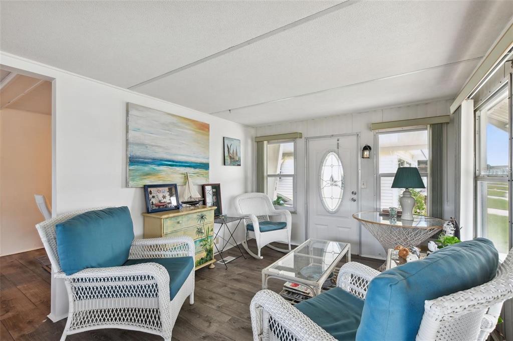 13225 101st Street Southeast, Unit 116 Largo, FL 33773 - Photo 11 of 22 a living room with furniture and a large window