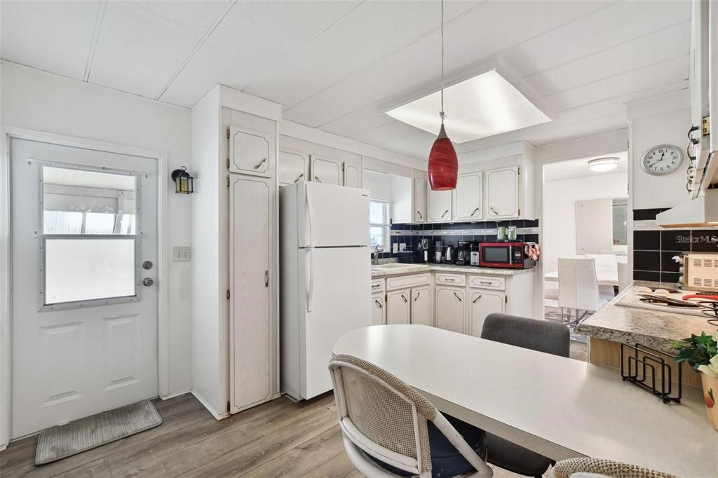 13225 101st Street Southeast, Unit 116 Largo, FL 33773 - Photo 2 of 22 a kitchen with stainless steel appliances a stove a refrigerator and a refrigerator