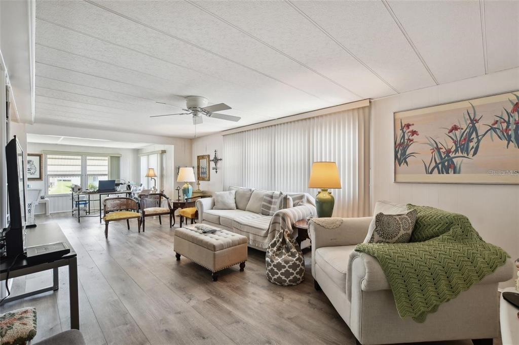 13225 101st Street Southeast, Unit 116 Largo, FL 33773 - Photo 8 of 22 a living room with furniture and a large window