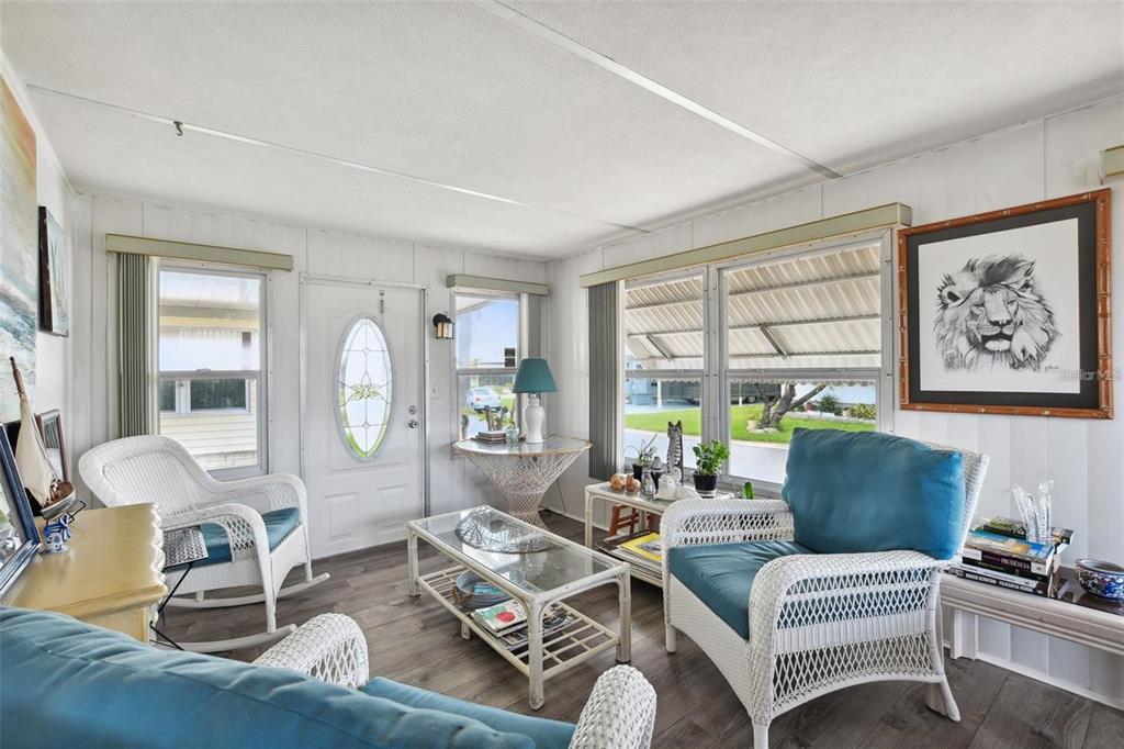 13225 101st Street Southeast, Unit 116 Largo, FL 33773 - Photo 10 of 22 a living room with furniture and a large window