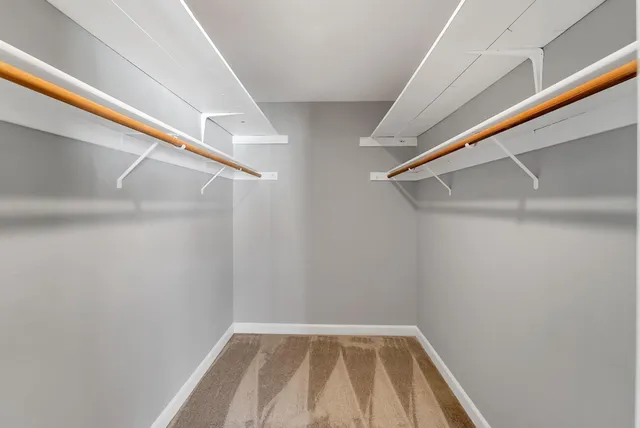 a bathroom with a white bath tub and a shower
