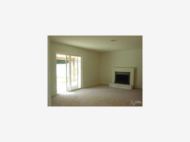 3340 Joshua Way Modesto, CA 95355 - Photo 4 of 7 a open kitchen with a sink and a fireplace